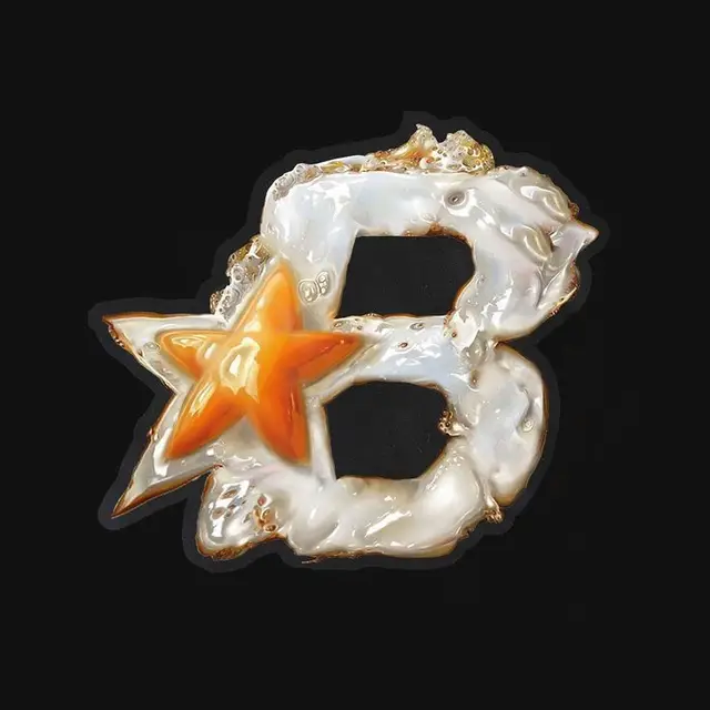 Glossy resin letter B with orange star and gold edges