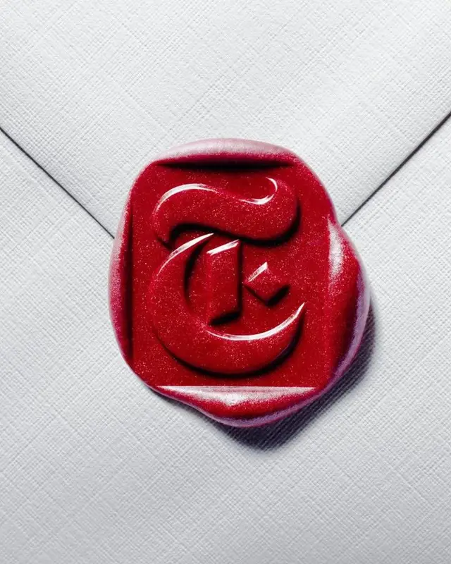 Red wax seal monogram 'T' on white linen envelope