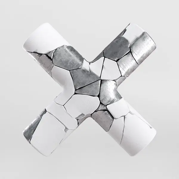 Fractured ceramic 'X' with exposed silver core — minimalist 3D sculpture