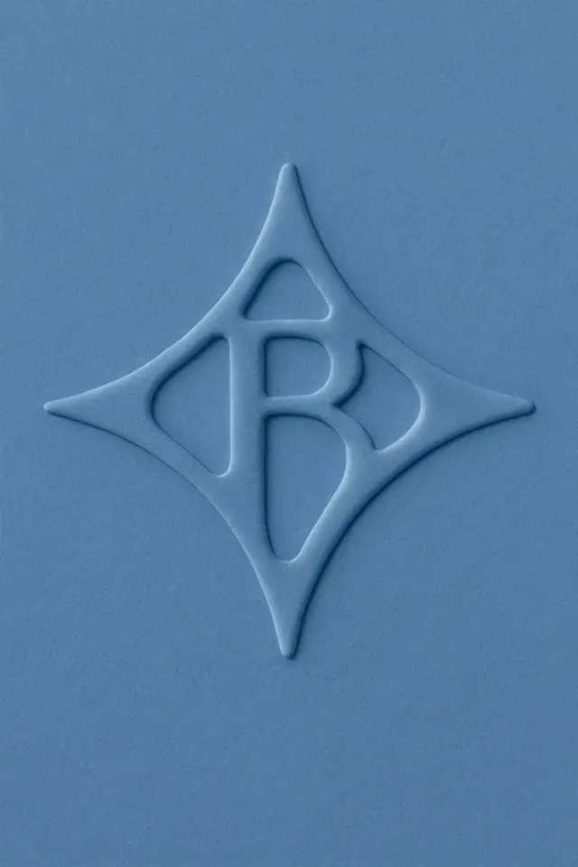 Blue embossed monogram in diamond-shaped emblem on textured stock