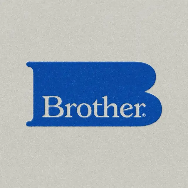 Brother blue wordmark logo on textured gray background