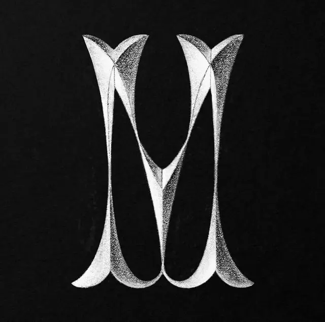 Stippled letter M monogram — ink stippling typography
