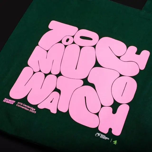 Dark Green Canvas Tote with Pink 'TOO MUCH TO WATCH' Bubble Typography — RTS Cambridge 202