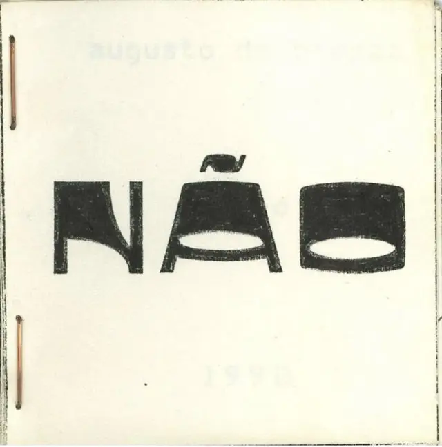 NÃO — stapled booklet cover with bold distressed block letters