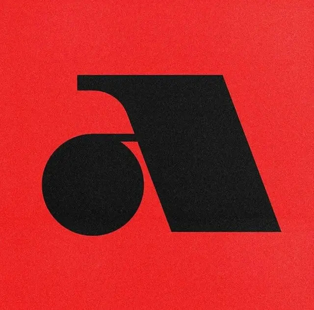 Black geometric monogram mark on textured red background