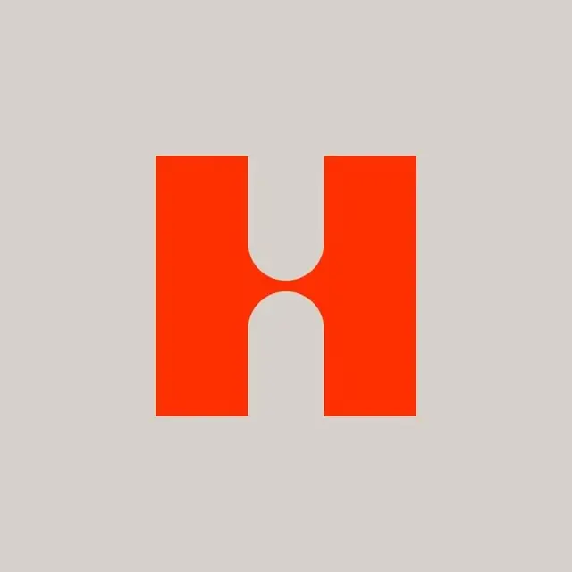 Minimalist orange 'H' logo with central negative-space arch