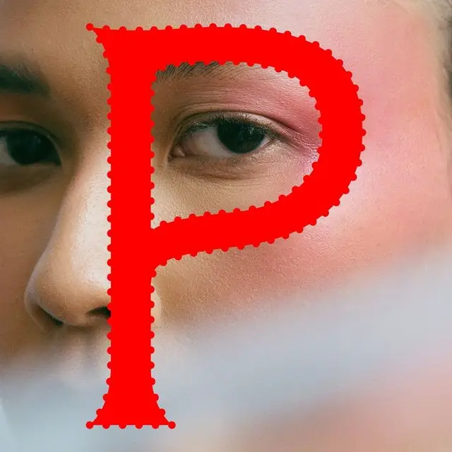 Close-up beauty portrait with oversized red 'P' graphic overlay