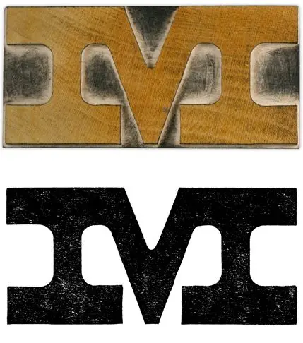 Brass letterpress block and distressed printed capital M