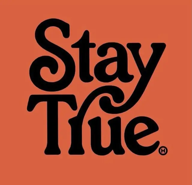Stay True — Retro Serif Wordmark on Burnt Orange Background