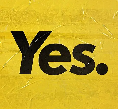 Bold black "Yes." on crumpled yellow poster