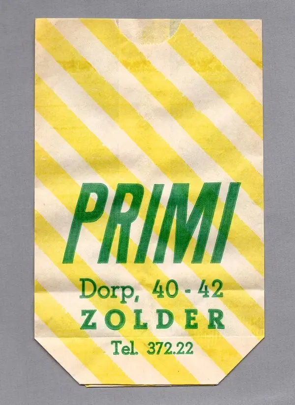 Vintage yellow-striped paper label with green PRIMI logo and address
