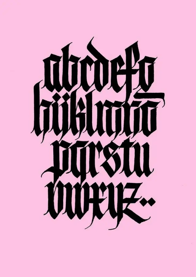 Hand-lettered blackletter lowercase alphabet on pastel pink