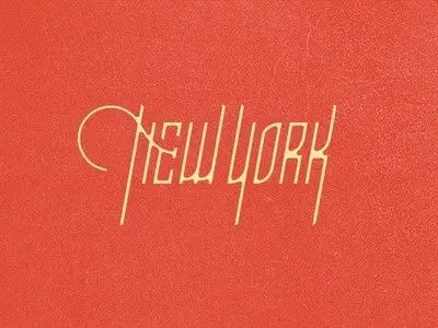 Art‑Deco "NEW YORK" gold lettering on coral textured paper