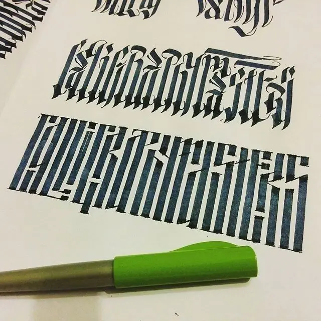 Blackletter calligraphy practice sheet with green-capped marker