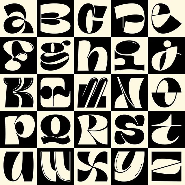 High-contrast decorative alphabet in black and cream