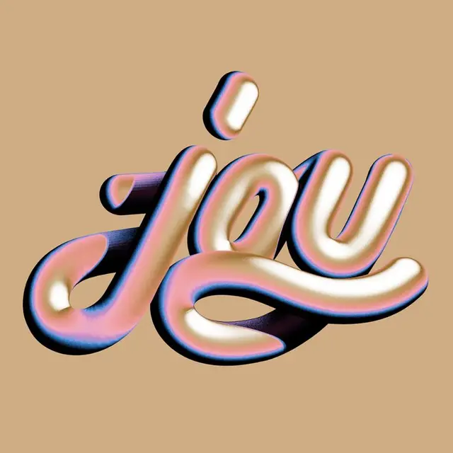 Pearlescent 3D script lettering reading "joy" on warm beige