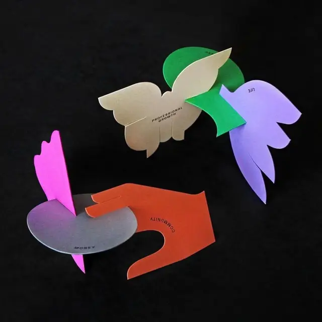 Interlocking die-cut cardstock: butterfly, hand, petals, disc