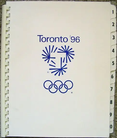 Toronto '96 comb-bound cover with blue emblem and Olympic rings