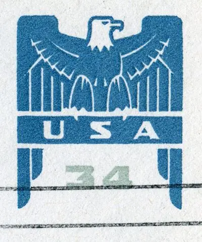 Blue eagle ink emblem with 'USA' and faded '34' on textured paper