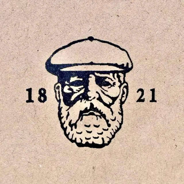Vintage stamped bearded man logo with flat cap and numerals '18 21'