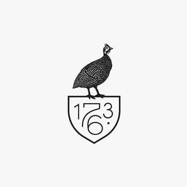 Guineafowl crest logo with '1736'