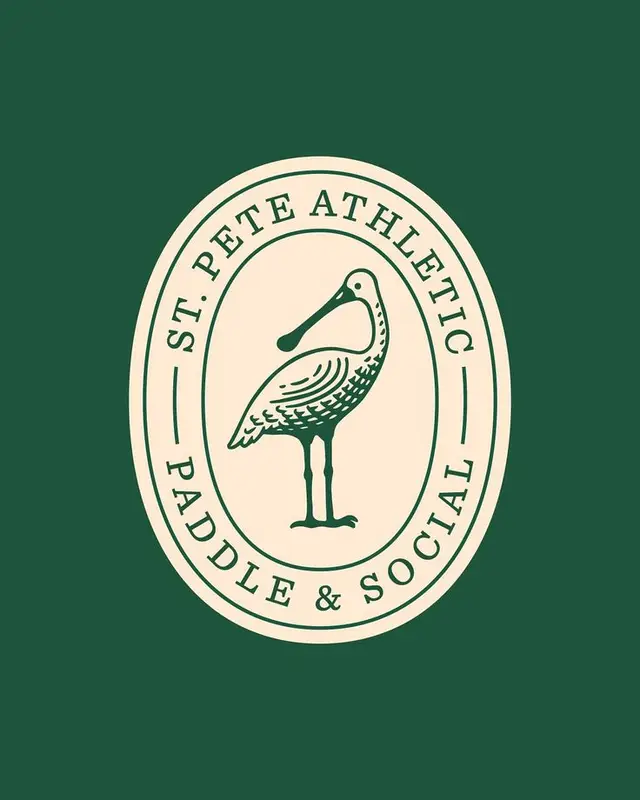 St. Pete Athletic — Paddle & Social oval badge (cream on green)
