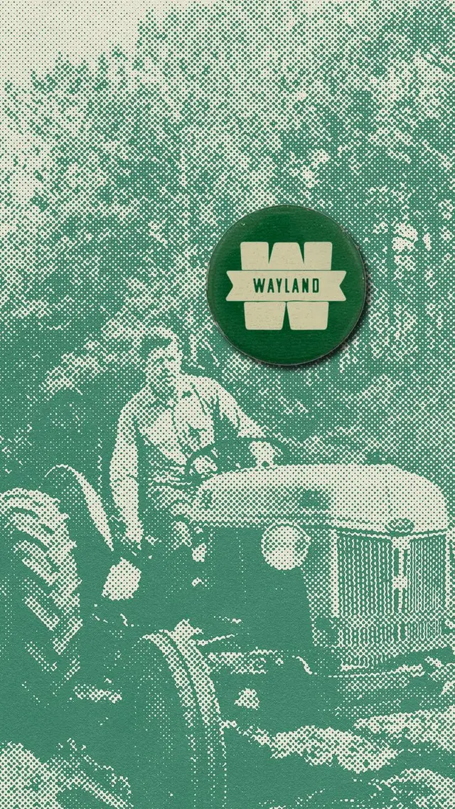 Green 'WAYLAND' badge on halftone tractor print
