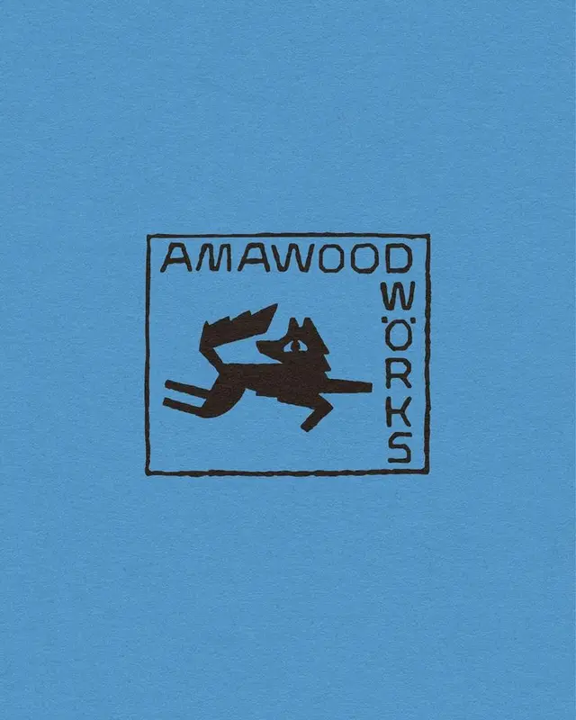 AMAWOOD WORKS hand-stamped fox logo on blue textured paper