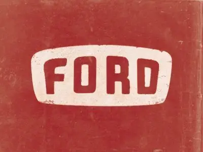 Vintage Ford wordmark on distressed red sign