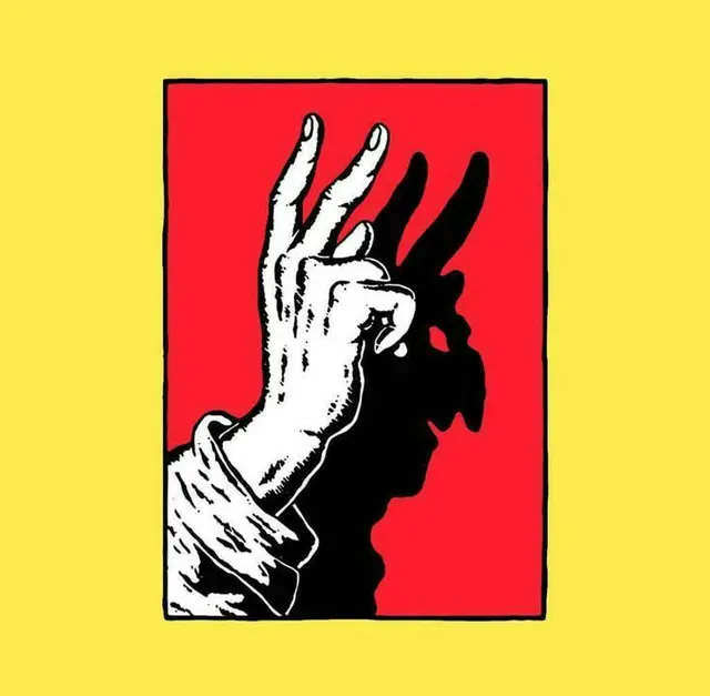 Hand casting rabbit shadow in red panel on yellow background