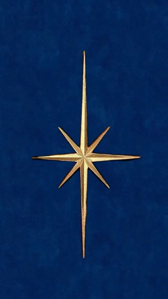 Gold Eight-Point Star on Royal Blue Velvet Background