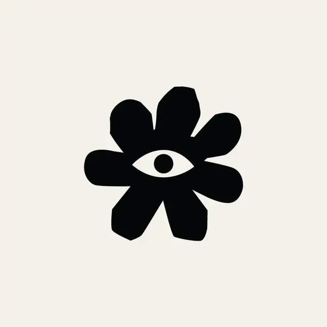 Minimal black flower emblem with central eye