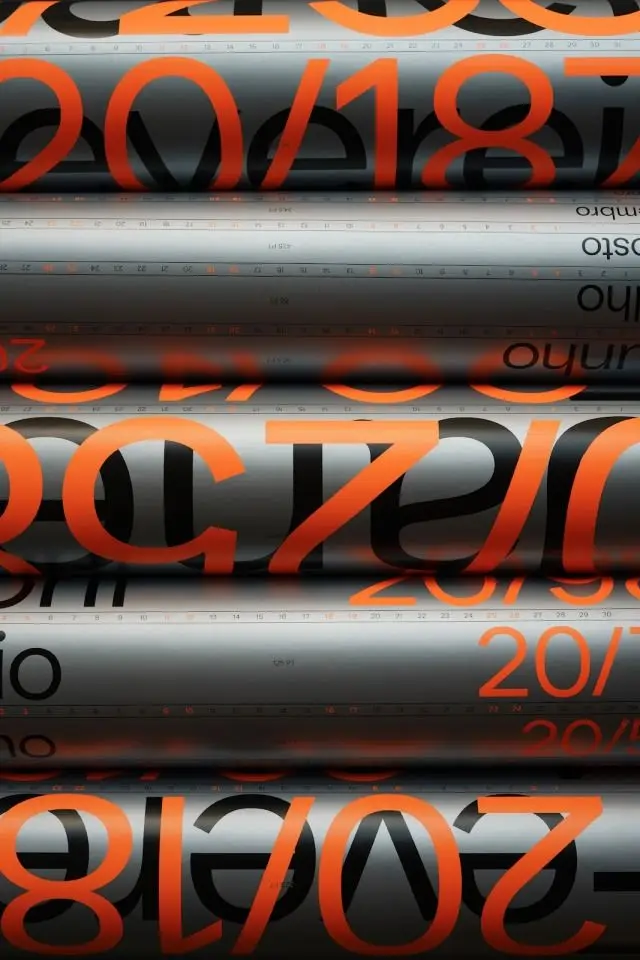 Stacked chrome printing cylinders with oversized orange 2018 typography