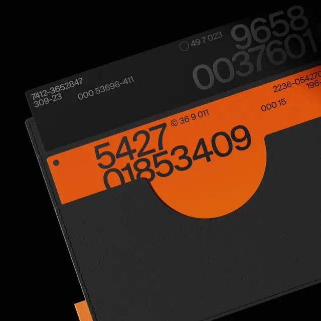 Black textured sleeve with orange die-cut tab and oversized numeric typography