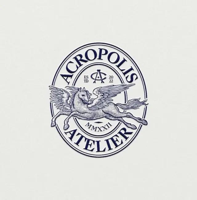 Acropolis Atelier embossed seal logo with winged Pegasus