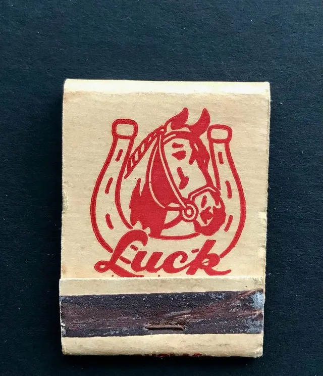 Vintage matchbook with red horse-and-horseshoe 'Luck' logo