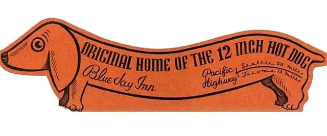 Vintage orange dachshund-shaped sign advertising 12-inch hot dog