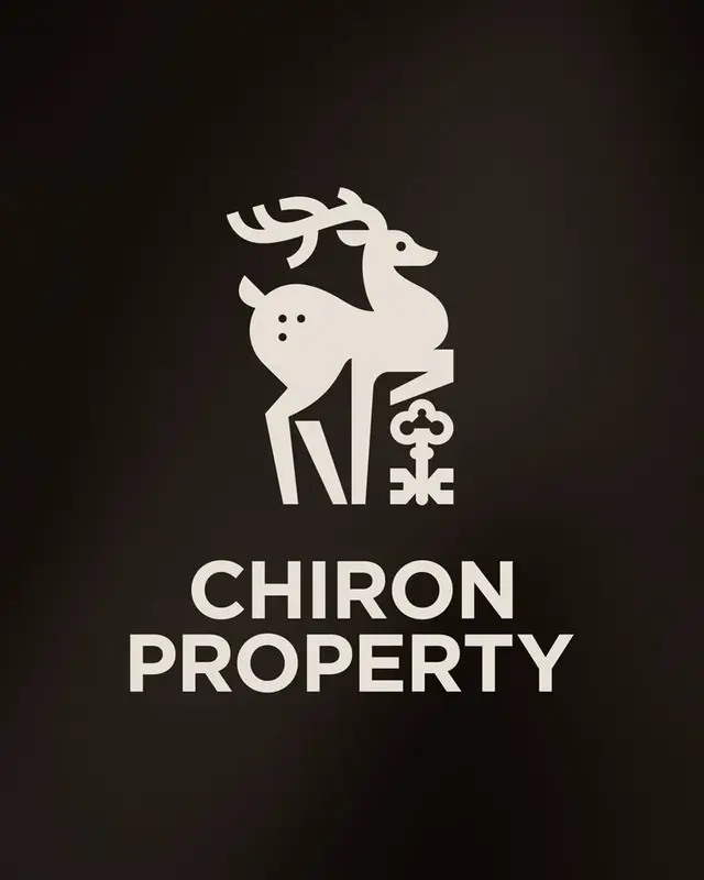 Chiron Property logo — stylized stag holding an ornamental key