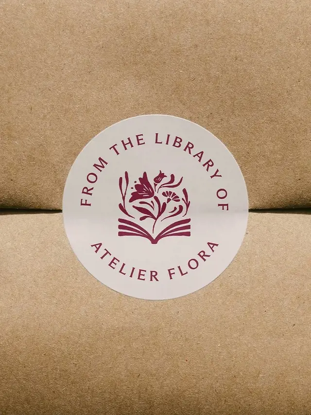 Round 'From the library of Atelier Flora' sticker on kraft box