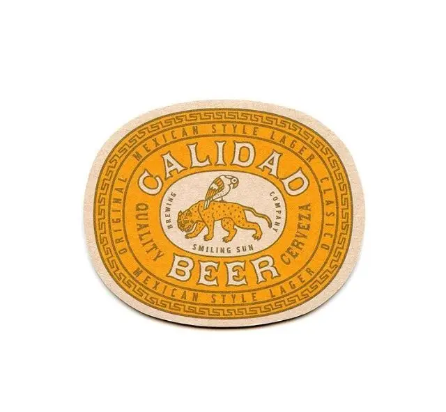 Vintage orange 'Calidad Beer' circular coaster with jaguar logo