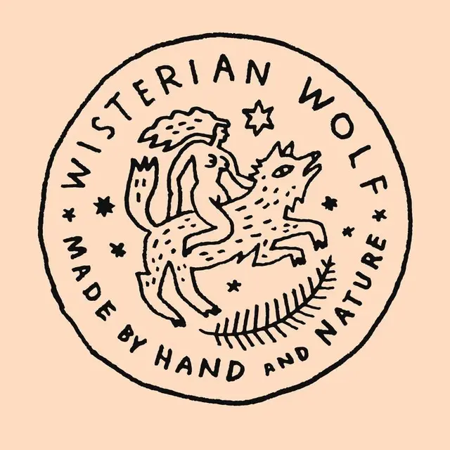Wisterian Wolf circular hand-drawn logo