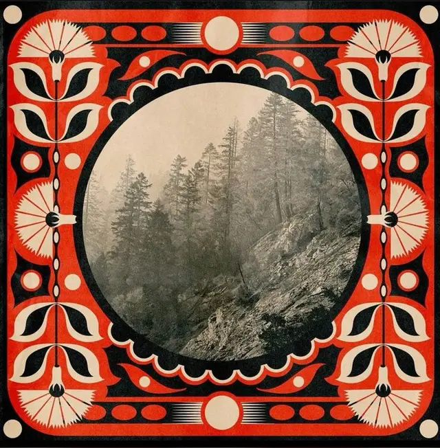 Circular sepia forest photo framed by red-and-black Art Nouveau floral border