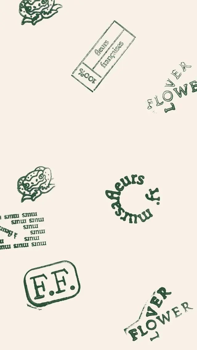 Hand-stamped botanical label pattern on cream paper