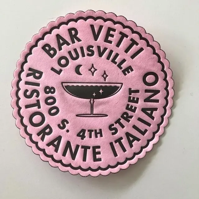 Pink scalloped circular 'Bar Vetti' ristorante sticker/coaster — Louisville logo