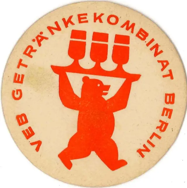 VEB Getränkekombinat Berlin — vintage round beverage coaster with bear logo