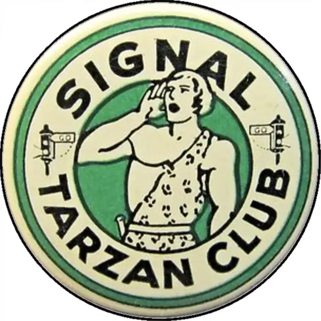 Vintage round badge reading "SIGNAL TARZAN CLUB" — green and cream club emblem
