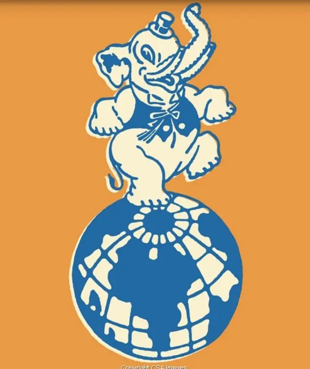 Vintage two-color circus elephant balancing on globe