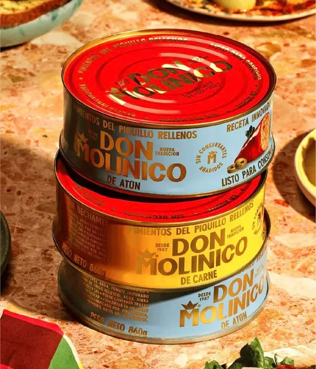 Stacked Don Molinico canned tuna and meat — retro Spanish packaging