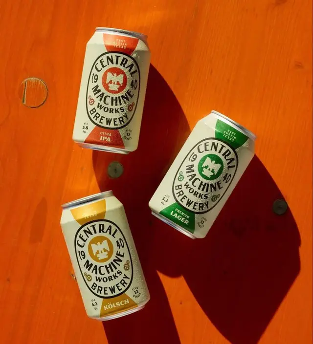 Central Machine Works Brewery cans — Citra IPA, Lager, Kölsch on orange wood
