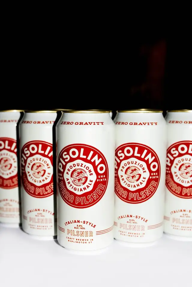Pisolino Birra Pilsner cans — white aluminum cans with red circular logo